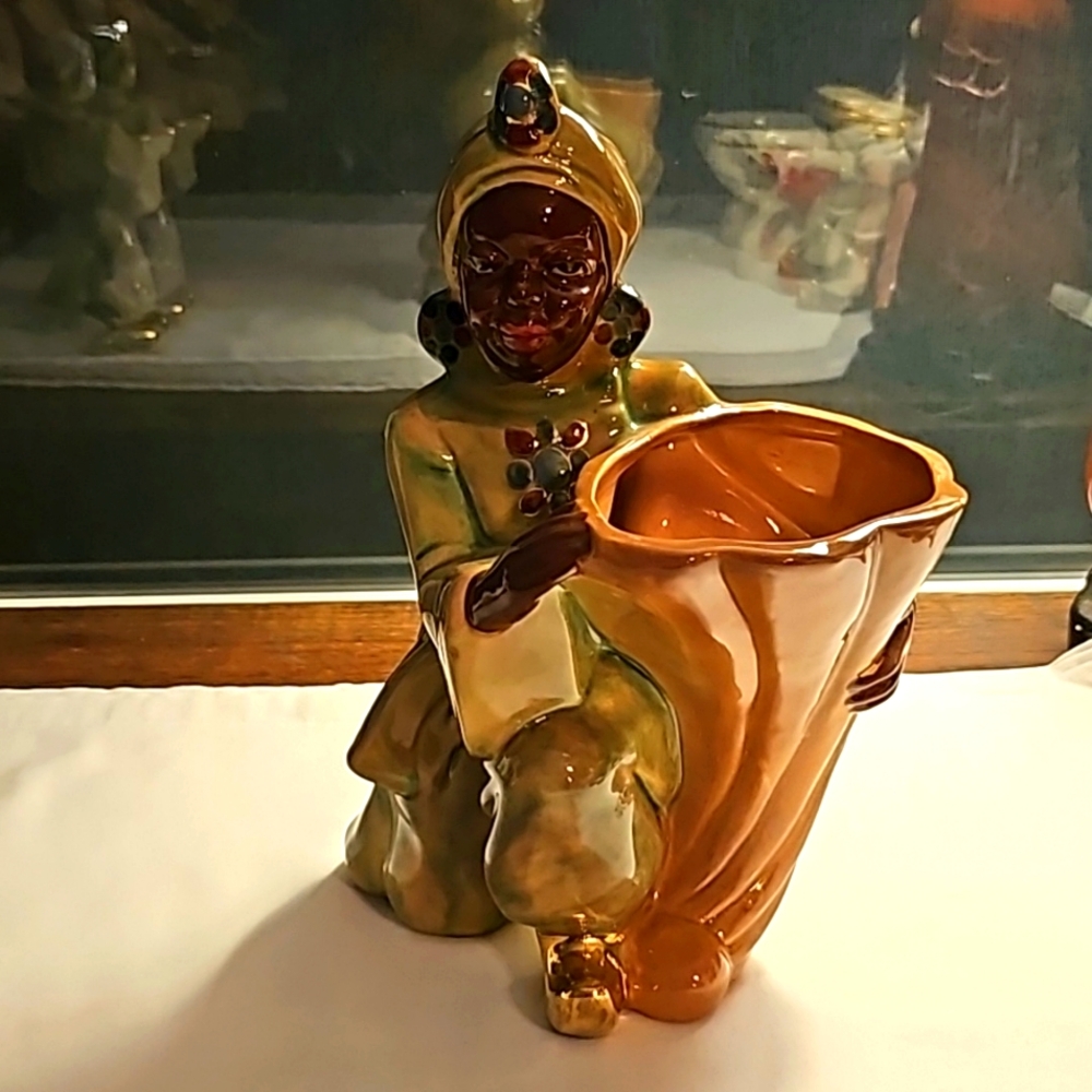 Vintage Blackamoore Figurine, Man holding cornucopia,  probably Brayton Laguna